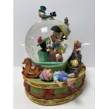 A Disney Pinocchio musical snow globe insert only