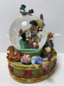 A Disney Pinocchio musical snow globe insert only