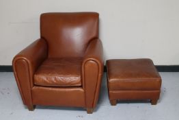 A tan leather Art Forma armchair with footstool