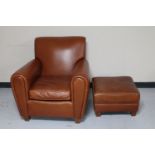 A tan leather Art Forma armchair with footstool