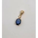 A 14ct gold sapphire and diamond pendant, the sapphire 1.45 carat, the diamond 0.07 carat.