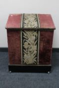 An antique fabric covered storage box