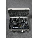 A camera case containing Nikon D300, Nikon D3100, Nikon 120mm macro lens, 450mm lens,