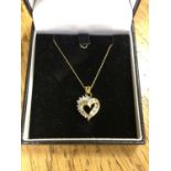 A 10ct gold diamond set heart pendant on chain