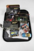 A tray of three boxed 007 Corgi vehicles, two further die cast vehicles,