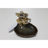 An Italian silver and silver-gilt figure of a knight on horseback, on polished stone base,