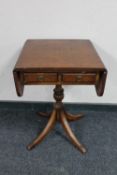 A Regency style flap sided occasional table