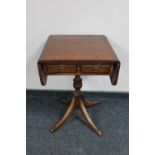 A Regency style flap sided occasional table