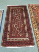 A Persian rug, on red ground,