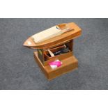 A part built wooden pond yacht on stand with accessories