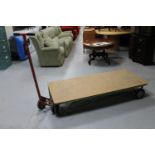 A metal flat bed trolley with handle