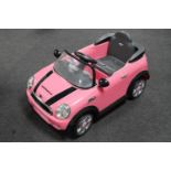 A child's electric Mini Convertible ride in car,