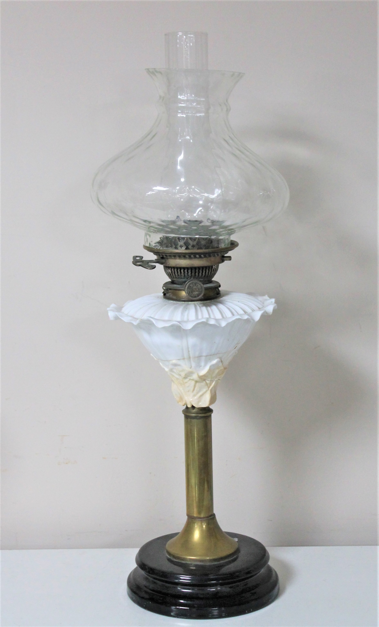 A Victorian Hinks safety oil lamp with glass chimney and shade CONDITION REPORT: