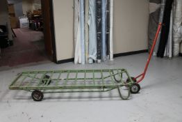 A metal flat bed trolley with handle