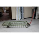 A metal flat bed trolley with handle