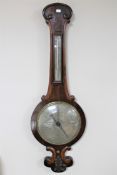 A Victorian rosewood based barometer with silvered dial