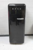 A Smeg upright fridge with freezer box