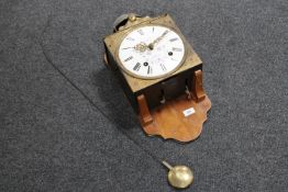 A continental enamelled dial wall clock by mounted on a walnut board,