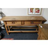 A Mexican pine hall table fitted two drawers