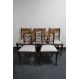 A drop leaf table and five Regency style dining chairs