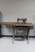A 20th century Singer sewing machine in oak table