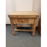 A pine butcher's block fitted a drawer,