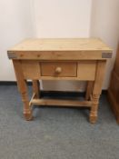 A pine butcher's block fitted a drawer,