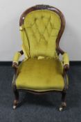 A Victorian mahogany armchair in buttoned dralon