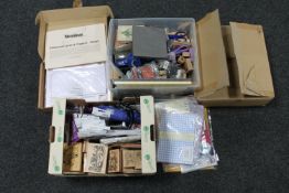 Four boxes of assorted crafting accessories, scrap book inserts,