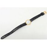 A lady's 18ct gold Omega De Ville wristwatch, on leather strap.