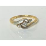 An 18ct gold diamond set crossover ring, size L. CONDITION REPORT: 2.3g.
