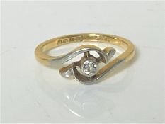 An 18ct gold diamond set crossover ring, size L. CONDITION REPORT: 2.3g.