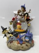 A Disney Winnie the Pooh & Friends musical light up revolving snow globe in original box