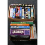 Two boxes of a large quantity of jigsaws and board games, painting kits,