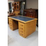 A 20th century oak twin pedestal desk with leather inset panel (slide missing)
