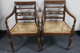 A pair of bergere seated armchairs