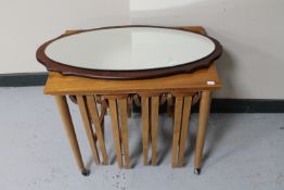 A teak table fitted four beneath together with a frameless mirror mounted on teak board