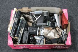 A box of vintage cameras, cameras books,