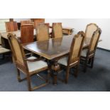 A Barker & Stonehouse Flagstone hardwood dining table on bulbous legs and six high backed dining