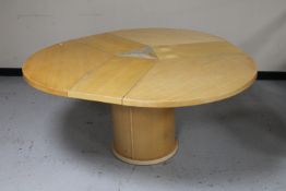 A Skovby circular pedestal extending dining table with three internal leaves