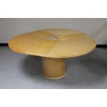 A Skovby circular pedestal extending dining table with three internal leaves