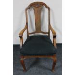 An antique oak armchair