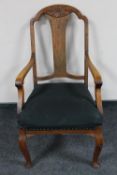 An antique oak armchair