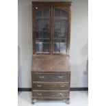 A 1930's oak bureau bookcase