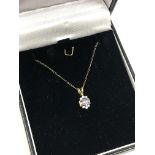 A 10ct gold tanzanite and diamond pendant on chain