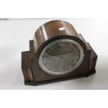 A 1930's walnut cased mantel clock
