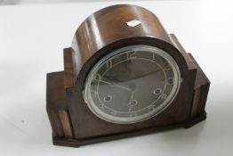 A 1930's walnut cased mantel clock