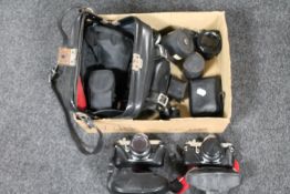 A box containing two Pentax MX cameras, lenses,