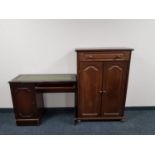 A continental style oak effect double door cabinet fitted a drawer together with a mahogany single