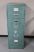 A metal four drawer filing cabinet